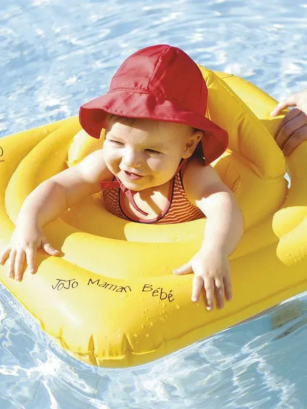 A baby in a Baby Swim Float.