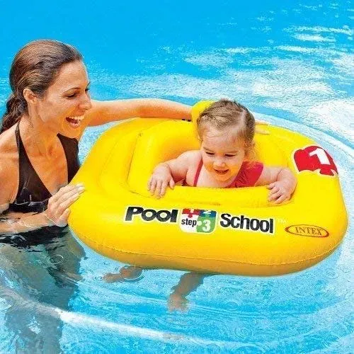 Mum in a swimming pool, with her baby in an Intex Deluxe Pool School Baby Float.