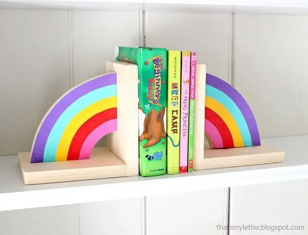 Each half of a rainbow as a bookend on either side of the books.