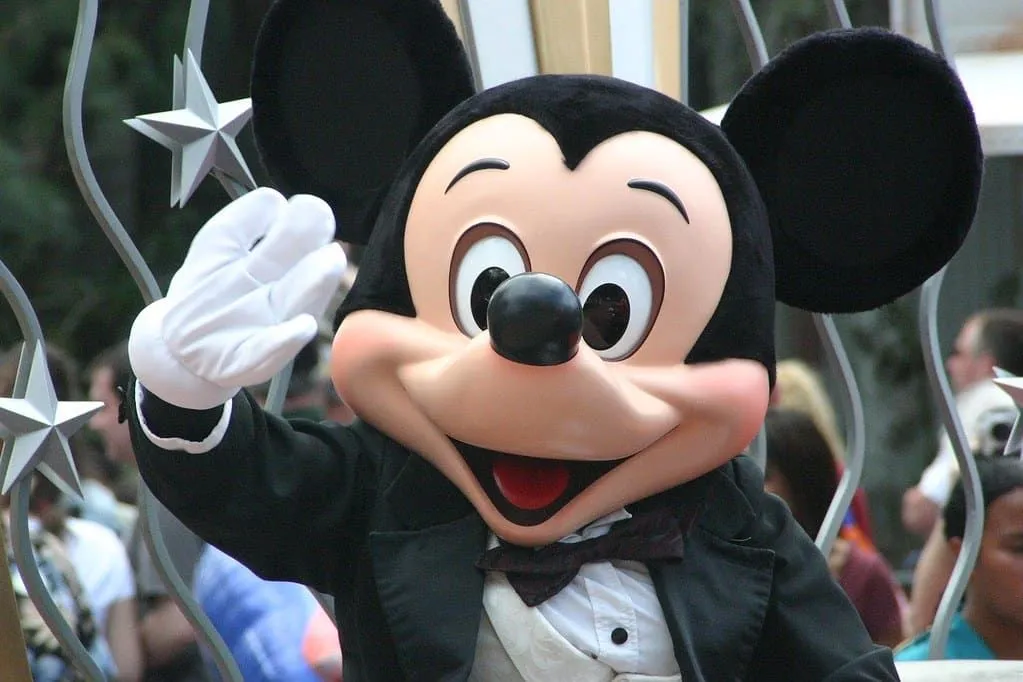 Mickey Mouse waving at Disneyland.