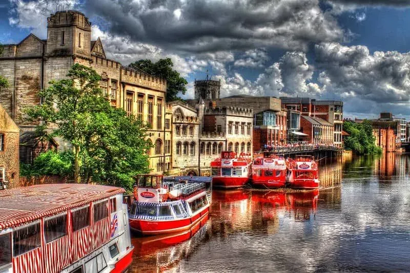 York City Cruises vessels standing stationery at a landing in York city centre. 