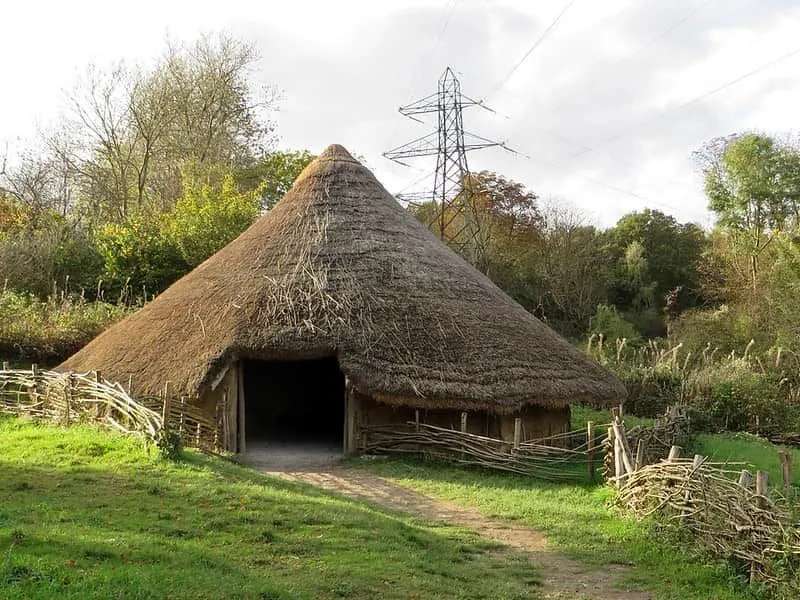 An Iron Age roundhouse with a pointed roof.