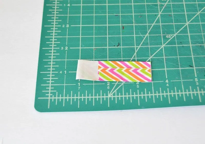 How to fold the tape to make a luggage tag.