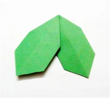 Green origami holly leaves.