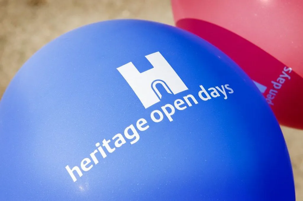 Heritage Open Days blue printed balloon with a red one next to it.