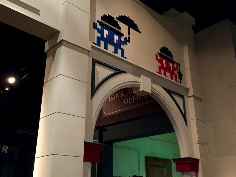Two space invaders guarding a doorway.