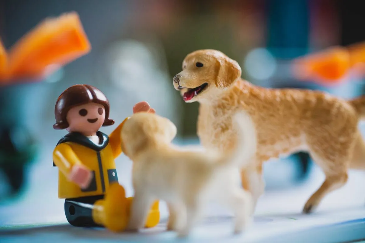 A close up image of some small animal toys, the image is focused on a toy dog.