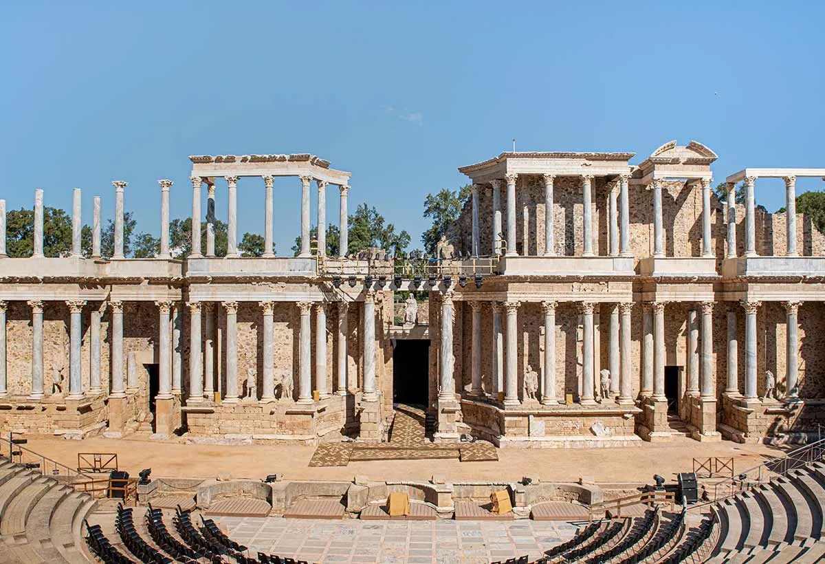 Roman ruins of a theatre in typical Roman architecture with many columns.