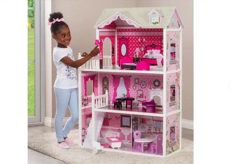 Girl playing with her doll house.