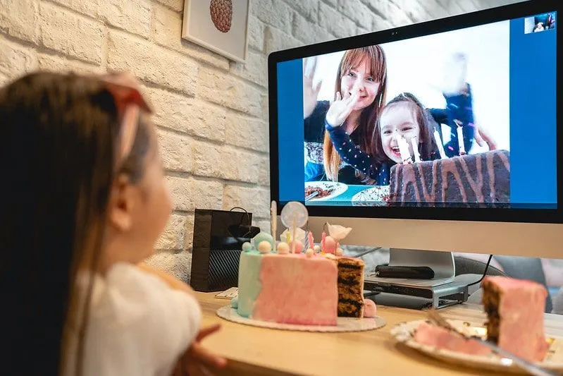 A little girl talks to her family via video call as the new Tier 2 rules in London mean she cannot mix with another household indoors.