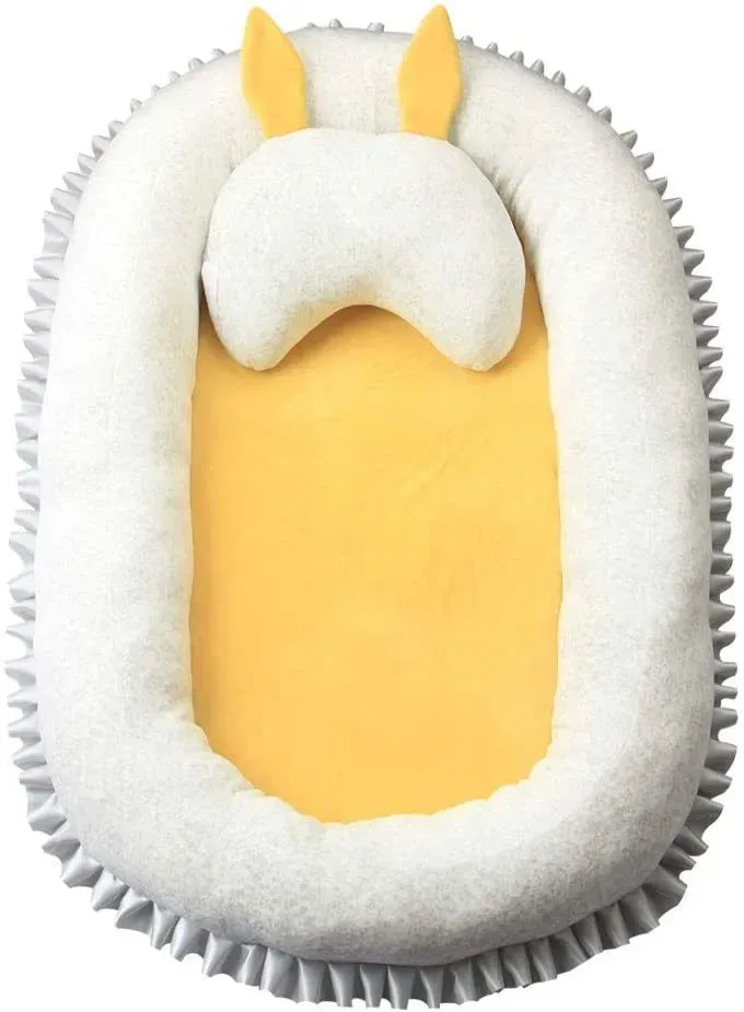 Cute and cotton bassinet bed with white yellow design.