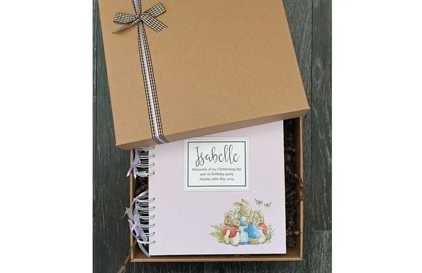 Excellent beautiful package of keepsake with scrapbook and bow perfect for memories storage.