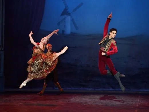 A male and female ballet dancer on stage of the Nutcracker Delights ballet.