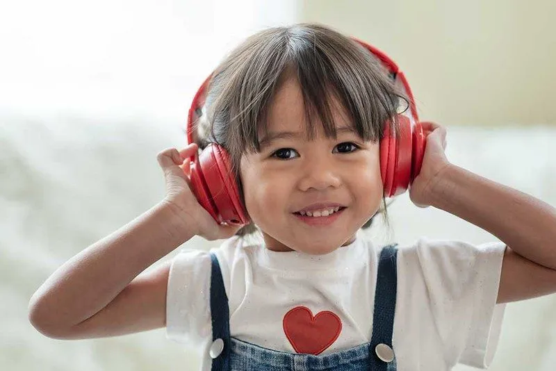 Child listening to MP3 player. 