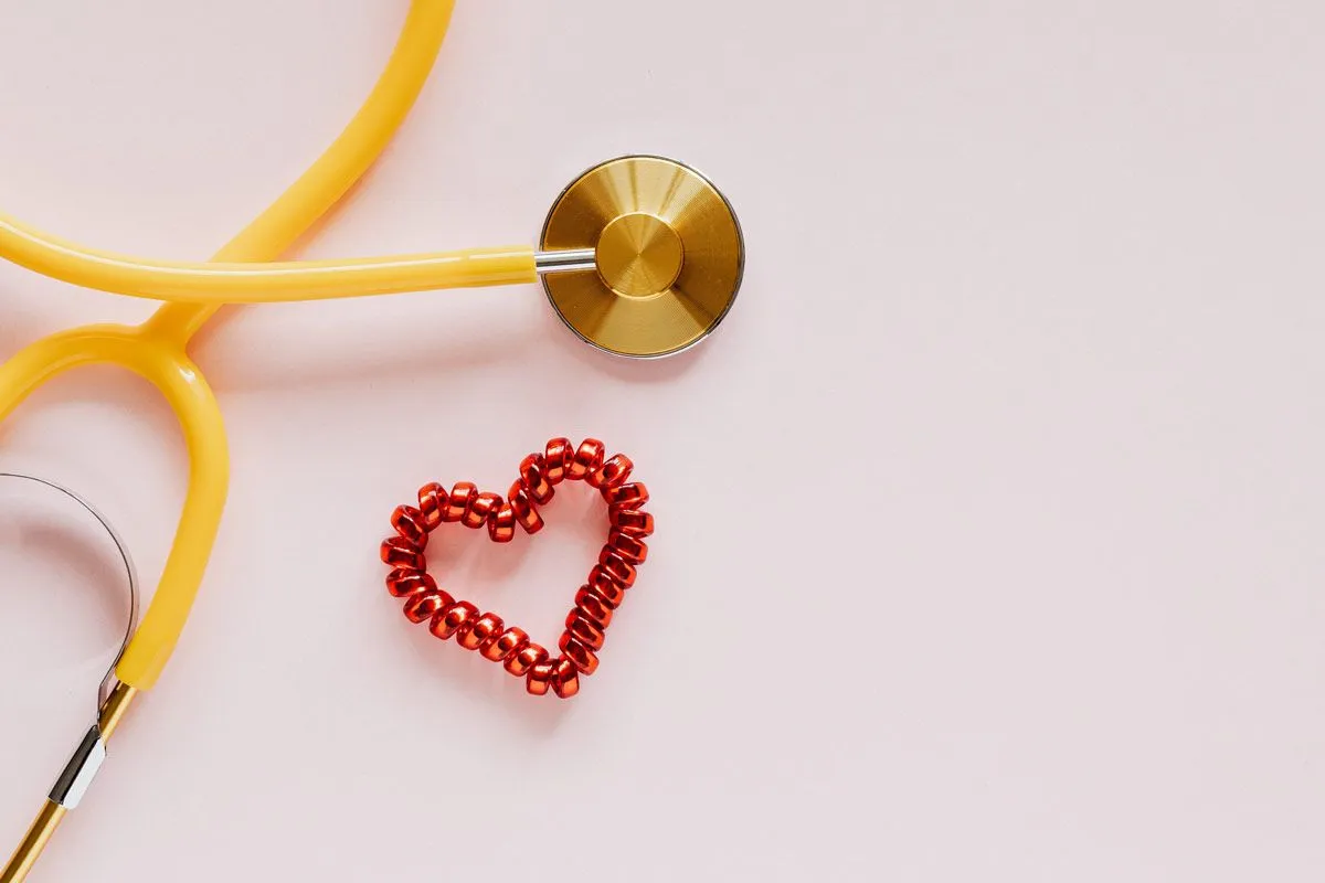 Red coil heart next to a yellow stethescope