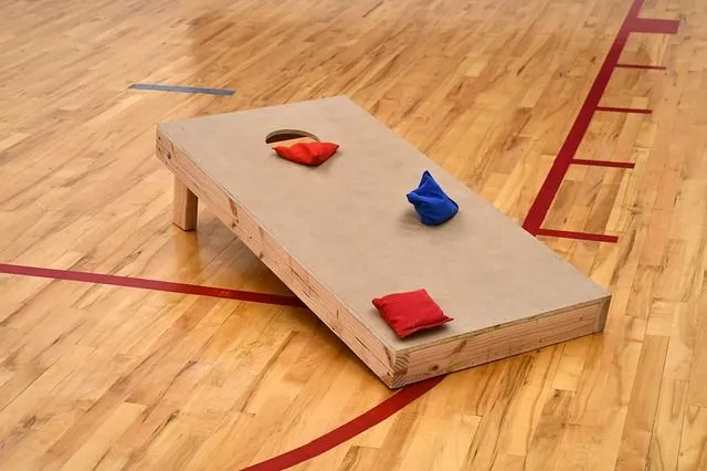 The cornhole game is a one-on-one game, where both team members throw the bags of corn in a hole game.