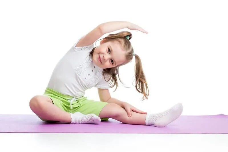 kid doing yoga pose