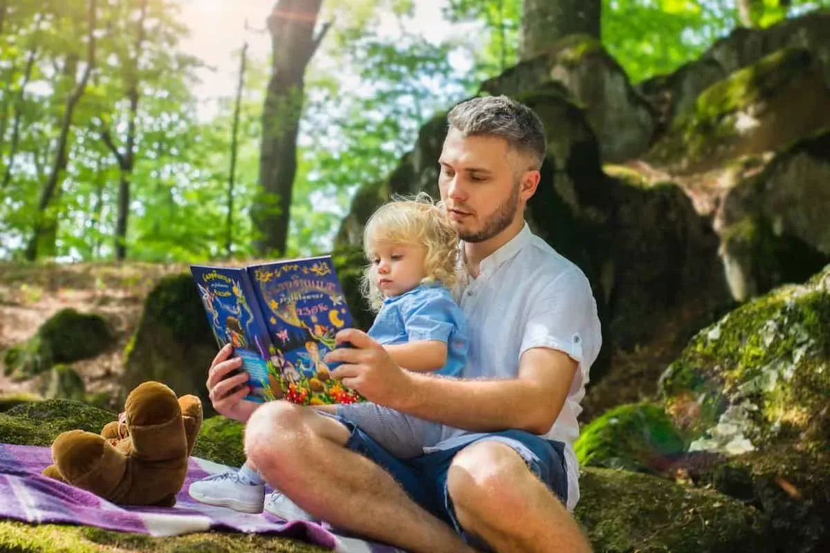 Dad reading his son a midday story.