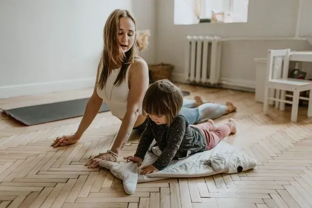 Both mom and baby will feel the benefits of a postpartum yoga class.
