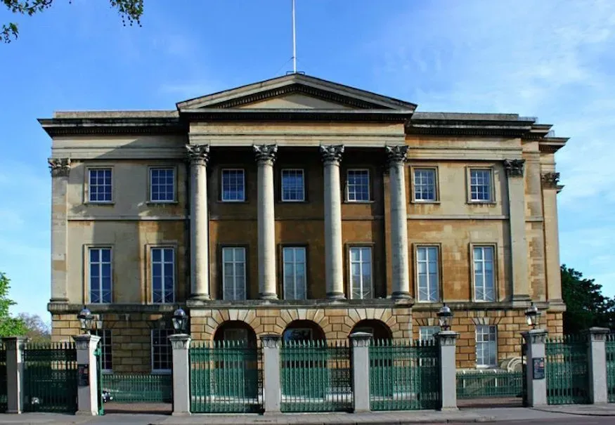 The exterior of the Apsley House building against a blue sky,