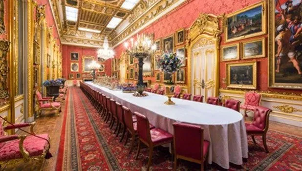 The grand dining room with a huge long table at Apsley House.