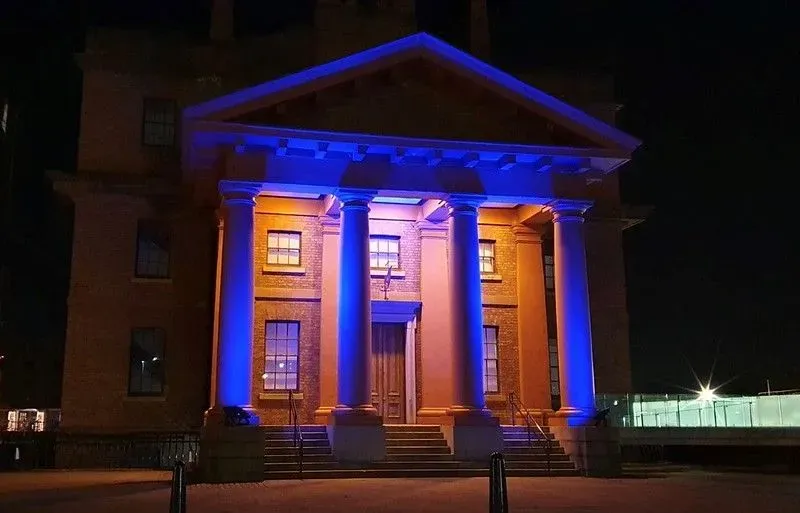 The outside of the International Slavery Museum lit up at night.