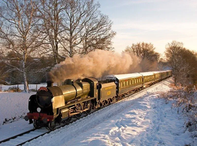 Bluebell Railway in winter surrounded by snow.