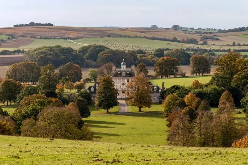 Ashdown House surrounded by the countryside of the Berkshire Downs.