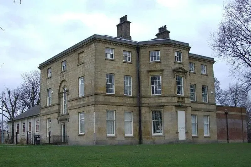 The exterior of Hillsborough Hall and library at Hillsborough Park.