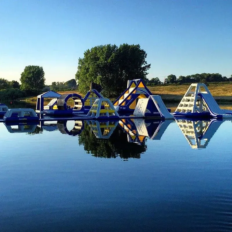 Inflatables reflected in Aqua Park Rutland lake.