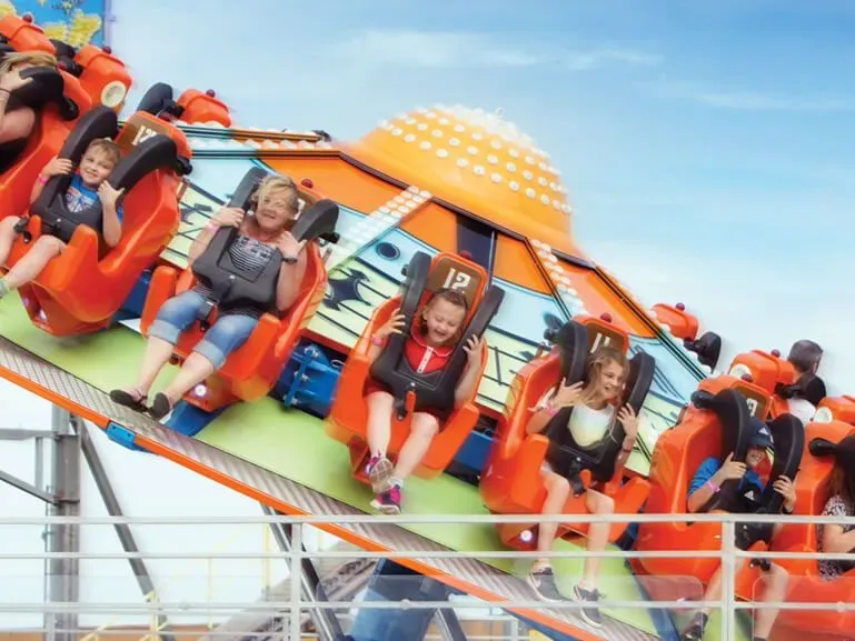 People spinning round on a roller coaster ride at Great Yarmouth Pleasure Beach.