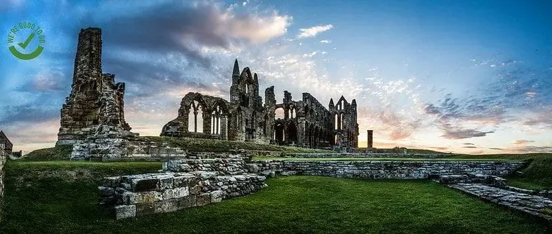 Whitby Abbey in North Yorkshire against a dramatic sky.