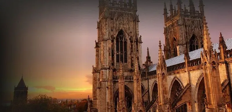 The Gothic York Minster from outside during sunset.