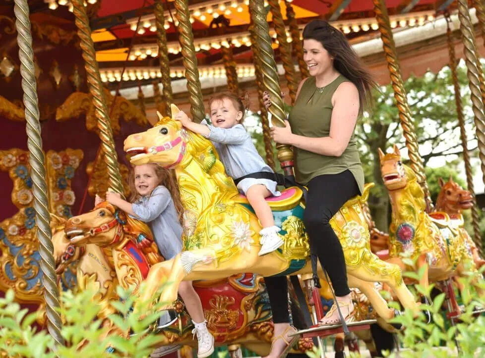 Mother and child on the Carousel at Wicksteed Park.