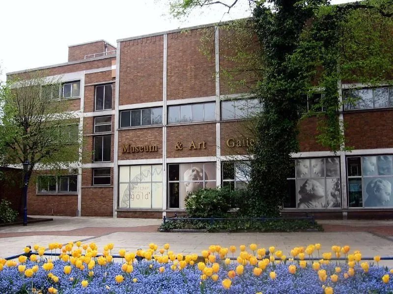 Front of Derby Museum and Art Gallery, flowers in front on exterior.