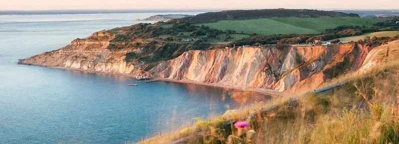 An overview of Alum Bay, showing off the famous coloured sand that makes up the cliifs.