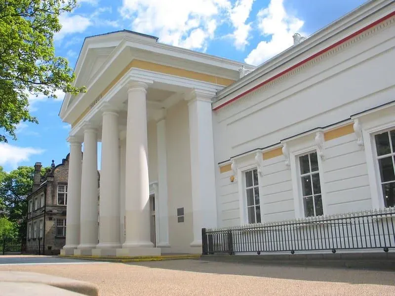 The main entrance of New Walk Museum with grand white pillars.