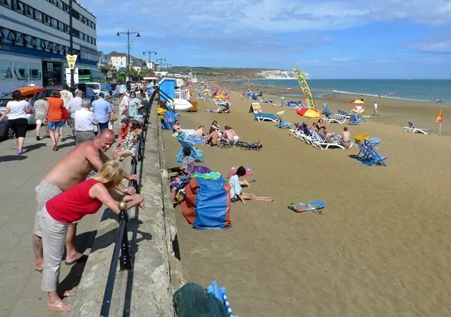 Families and tourists enjoying Sandown Beach.