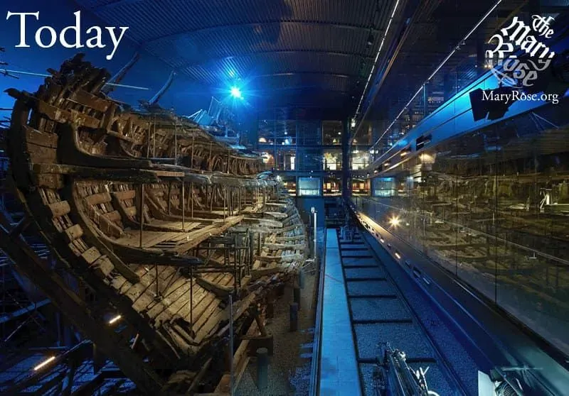 The Mary Rose shipwreck on display behind glass at The Mary Rose museum.