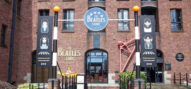 Exterior of The Beatles Story museum in Liverpool with illustrations of the band.