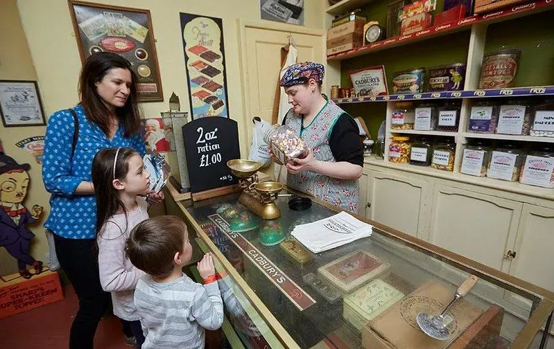 Child and parent at Victorian sweet shop
