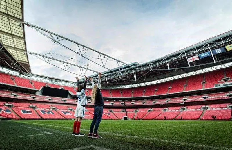 Children on pitch of Wembley Stadium.