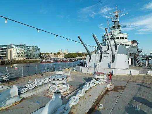HMS Belfast moored on a sunny day.