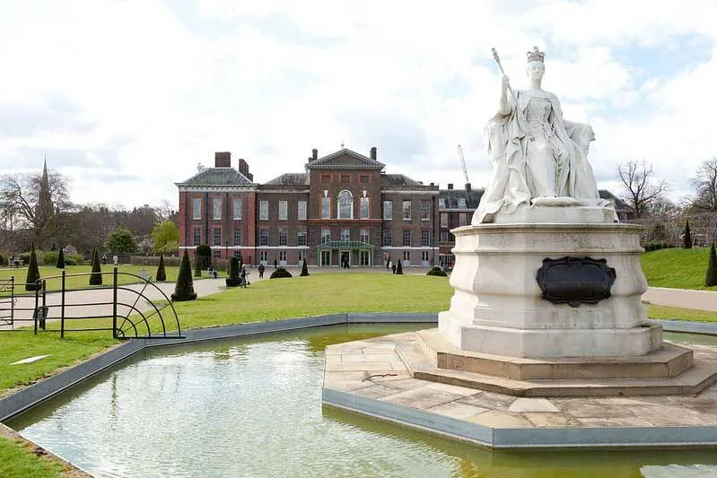 Statue of queen in small pool at Kensington Gardens.