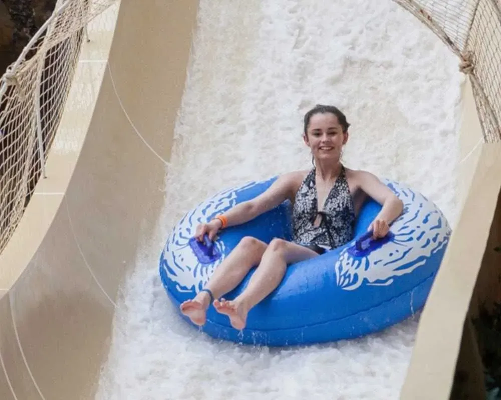 Girl going down Masterblaster at Sandcastle Waterpark.