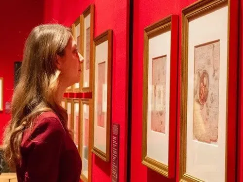 A visitor looking at The Queen's Gallery exhibitions.