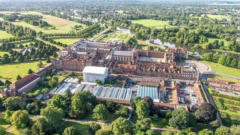 High angle shot of Hampton Court Palace and its surrounding grounds.
