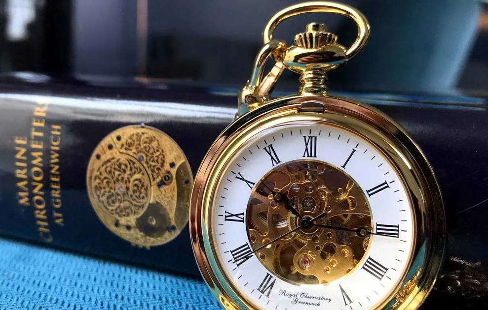 A crafted gold Hunter pocket watch.