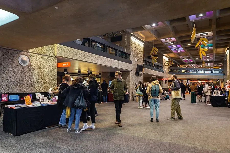 People milling about inside the Barbican Centre.