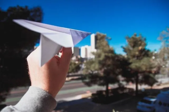 A cute little paper airplane ready for a short flight in the air.